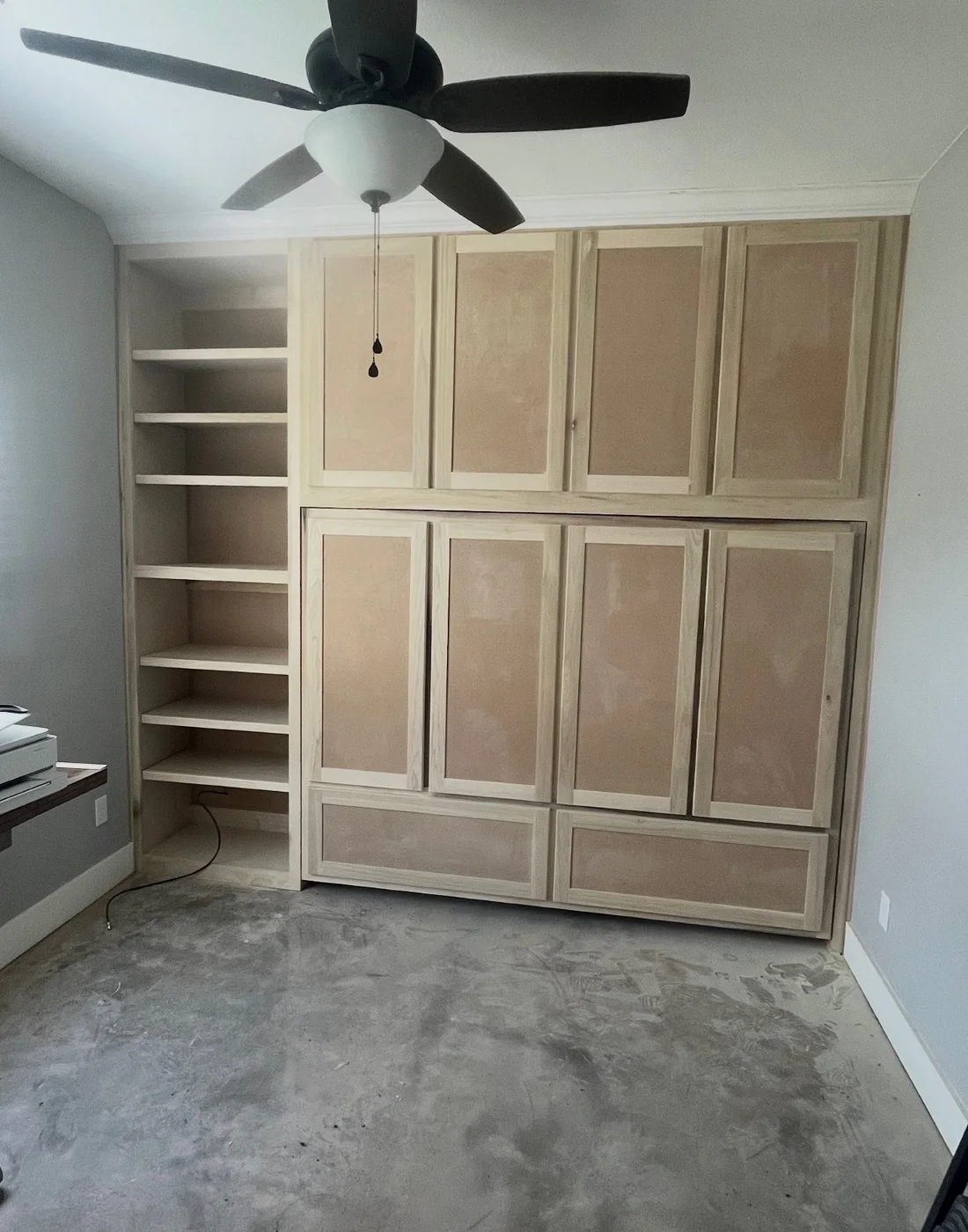 Built-in wall-bed cabinet in the closed position